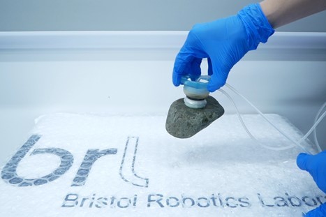 Suction cups lifting a stone.